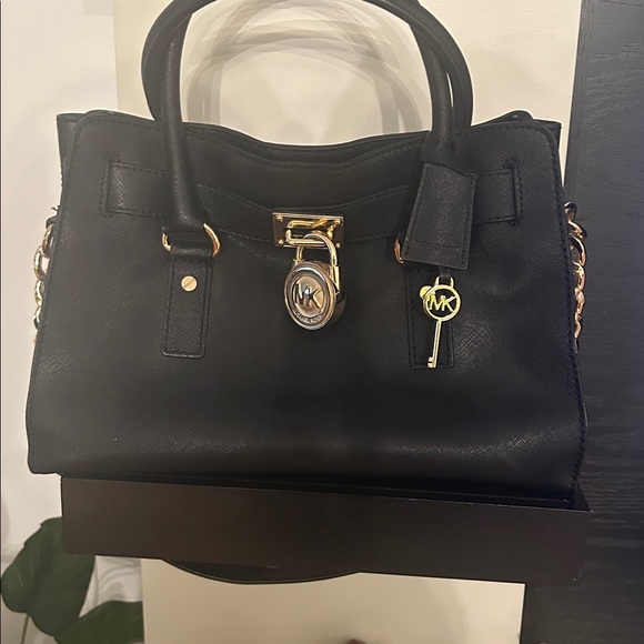 Michael Kors Handbags - Michael Kors Black and Gold Satchel with Structured Design